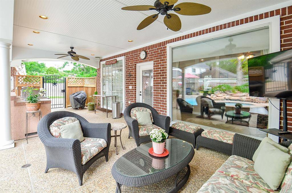 The lush covered patio is bound to be your summer showplace for casual family enjoyment and summer entertaining, with the picture window (right) offering beautiful views from both inside and outside.