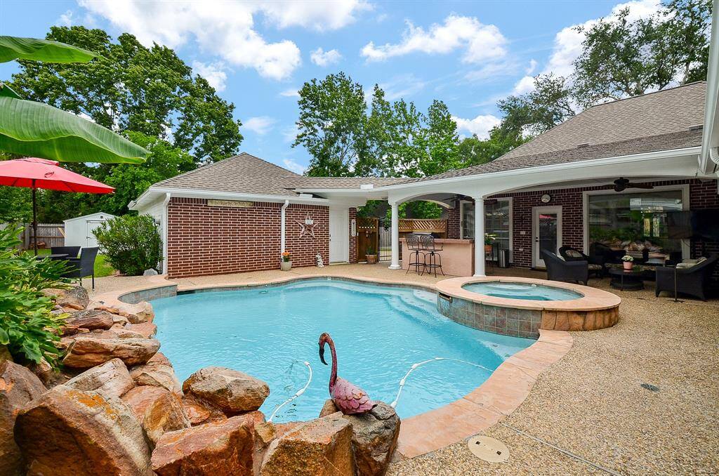 The beautiful rock formation feature is with a waterfall and complemented by natural greenery in your special pool and spa.