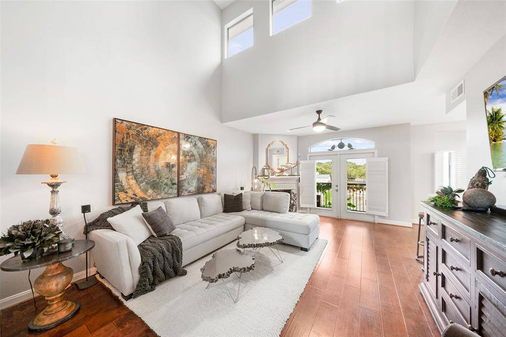 From this angle, you can see beautiful French doors adorned with lovely plantation shutters.  These doors lead to the townhome's balcony.