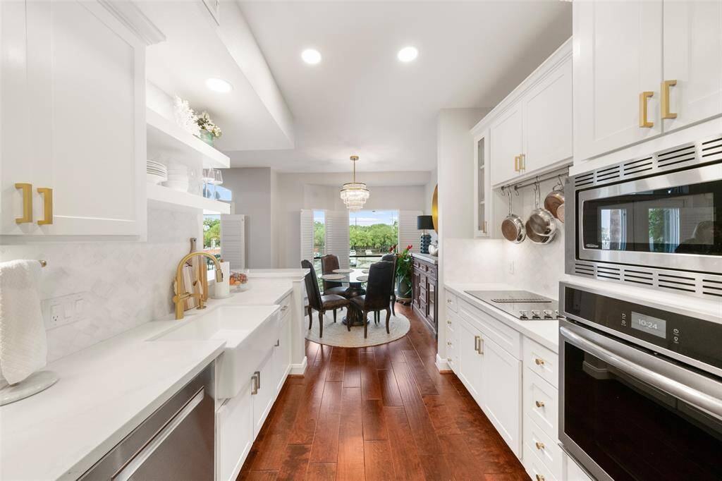 The gleaming hardwood floors continue through the kitchen.