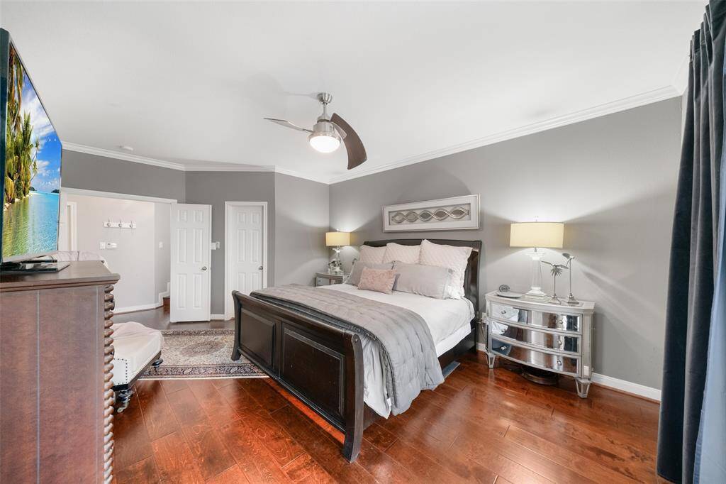 This primary suite is ideal, with two, spacious walk-in closets. The first closet is located by the door to the hallway.