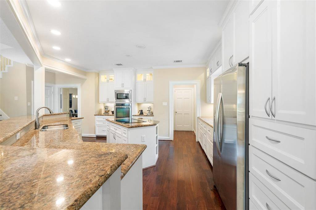 The open layout and recessed lighting create a bright, inviting space perfect for cooking and entertaining.