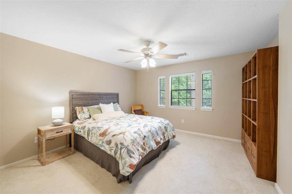 Large bright bedroom providing both functionality and warmth.