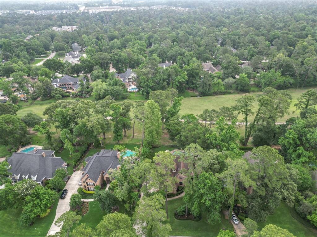 The golf course is with a mix of natural greenery and manicured lawns, providing an inviting atmosphere for potential homebuyers seeking tranquility and space.