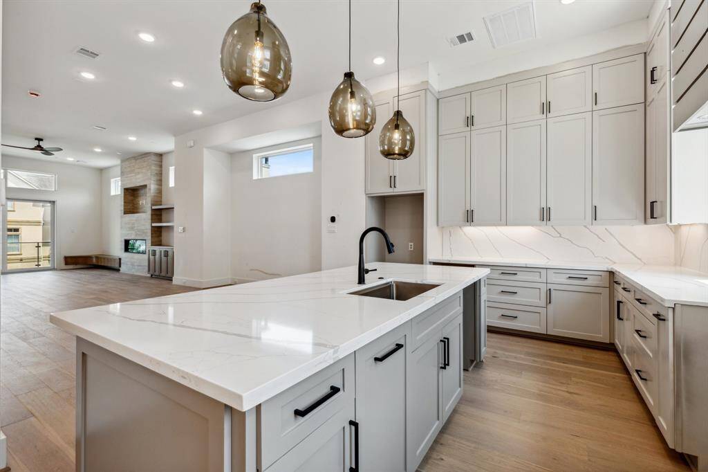 The fabulous kitchen seamlessly opens to the formal dining room and living room, ideal for entertaining and everyday living.