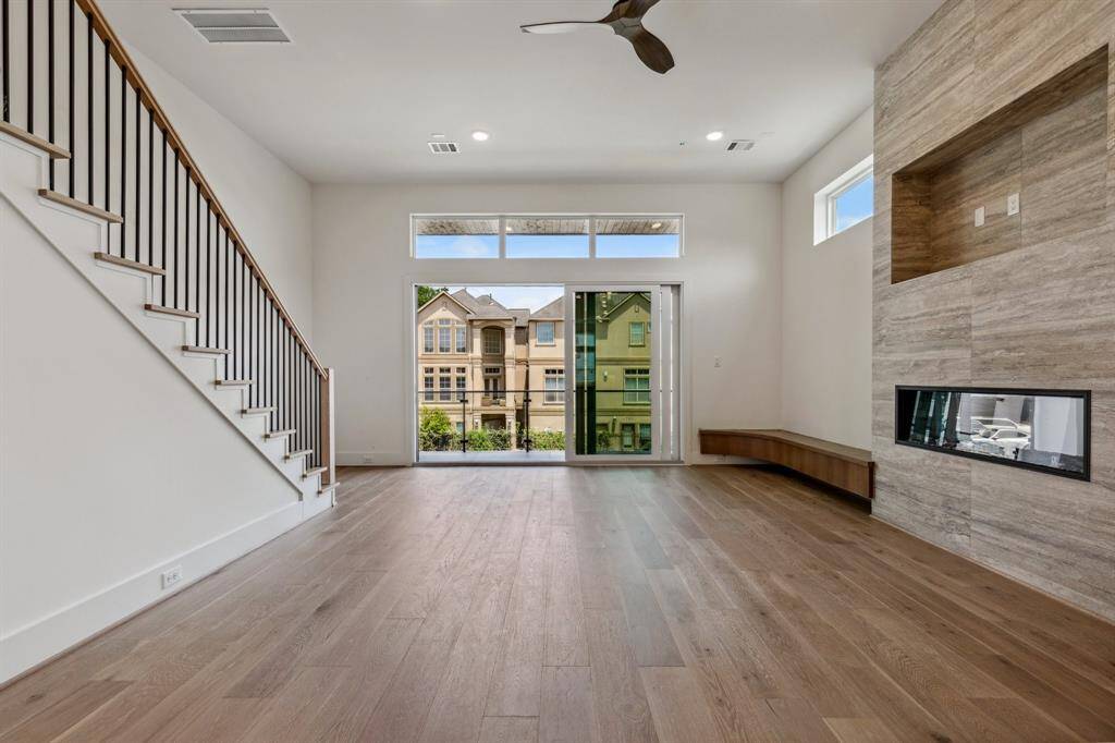 A view of the living room without furniture. Imagine entertaining here with the Ply Gym 3-panel sliding doors opening all the way to reveal the large balcony space! An expansive room offering lots of room for large furnishings.