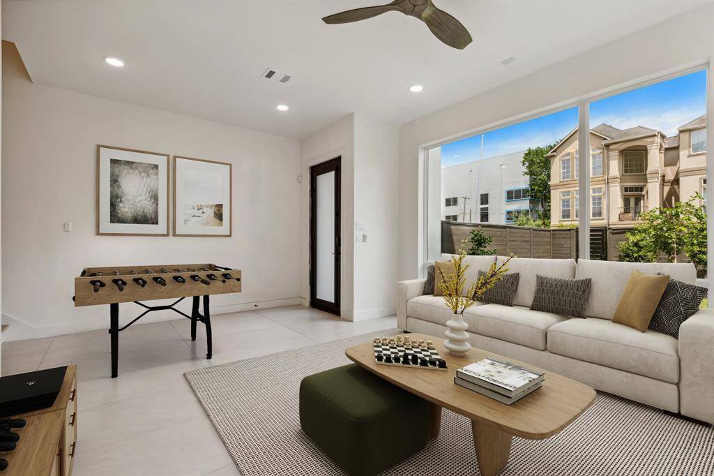 Another view of this large flex space with views of the front yard from the expansive Sierra Pacific windows! Note: this photo has been virtually staged.
