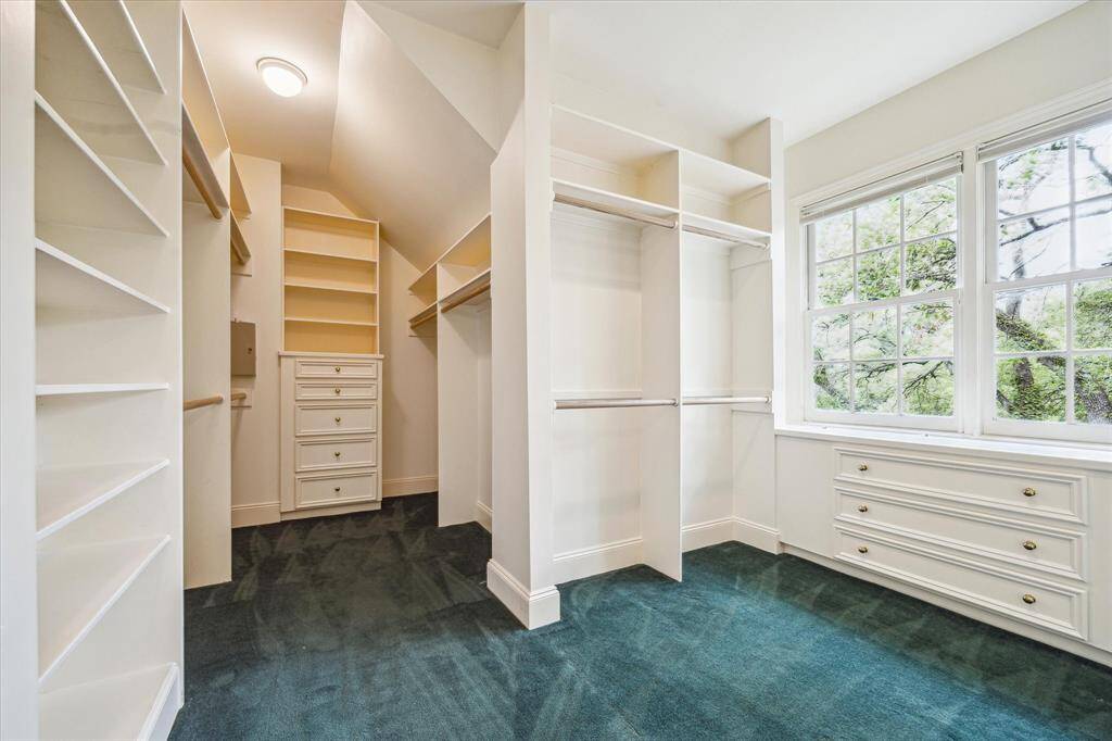 Large walk-in closet with an abundance of organizational and storage space.  Large picture window allows for great natural lighting.