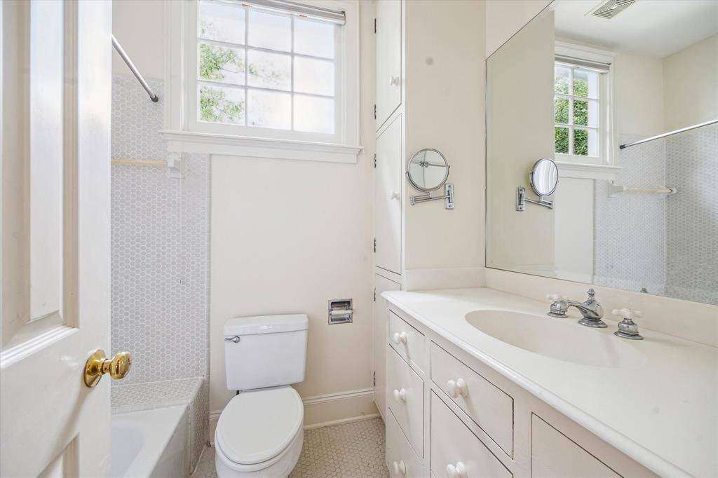 Secondary bathroom with tub/shower combination and tile flooring