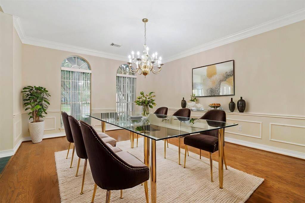 With 4,600 sq ft of living space, this home presents wood flooring, high ceilings, and an inviting floor plan ideal for both everyday living and grand entertaining.