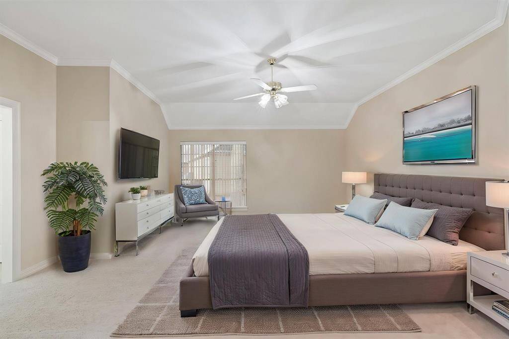 The expansive owner’s suite provides a serene escape, complete with a private sitting area and an en suite bathroom.