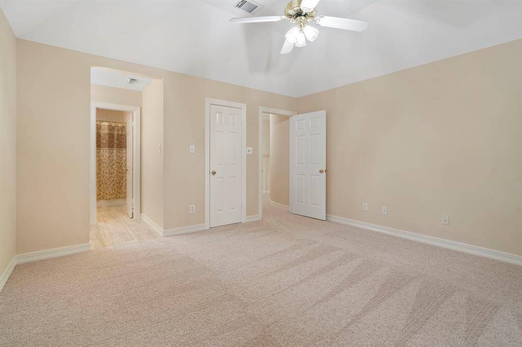 This bedroom shares an en suite Hollywood bathroom with an adjacent bedroom, offering convenience and privacy while maintaining a connected, open feel."