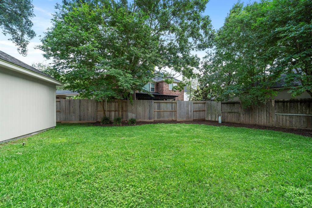The well-maintained lawn provides an ideal space for outdoor activities and playtime, while also offering a blank canvas for future enhancements like a patio, garden, or pool.