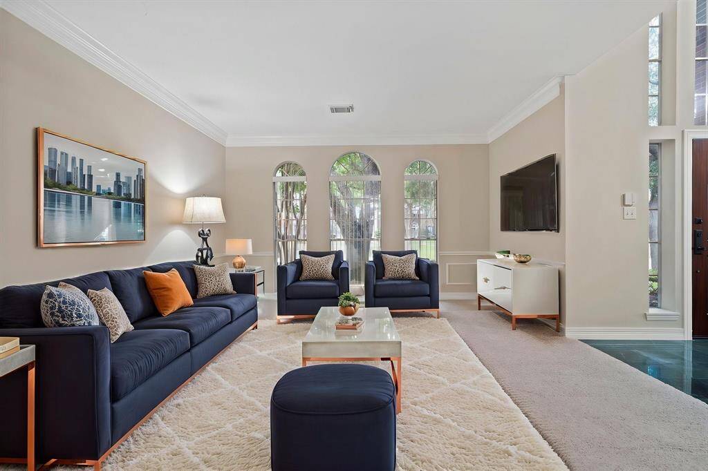 The formal living room offers a versatile space that can be tailored to suit your lifestyle.