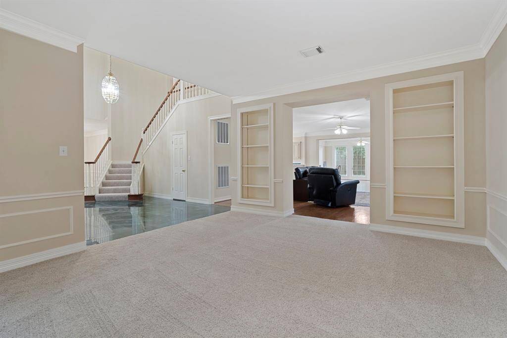 Built-in bookshelves and generous storage solutions enhance both the beauty and functionality of this home.