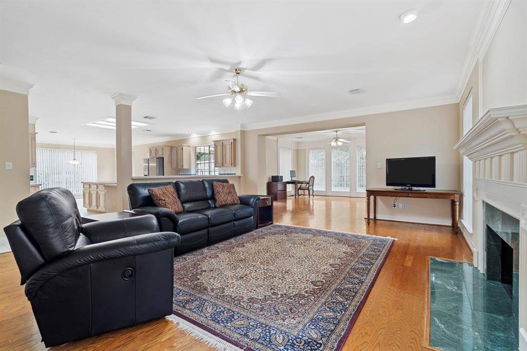 Adjacent to the kitchen, the family room offers seamless flow and abundant natural light.