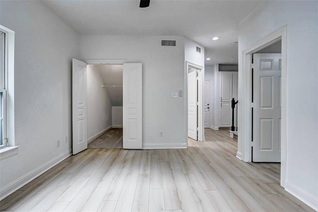 Deck this out for the perfect Mother in-law suite! Like to travel? Closet straight ahead is perfect for suitcases! Full bathroom across from stairs.  Backdoor leads to garage.  Lots of storage cabinets, stairs lead to 2nd floor, and full bedroom downstairs too.
