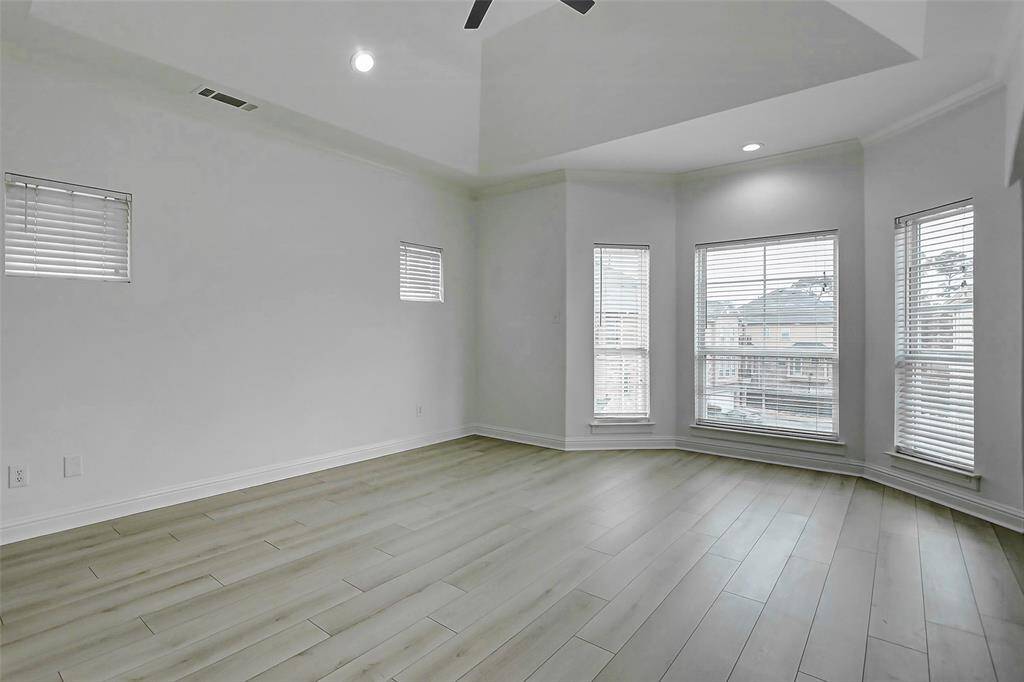 With room for a king-sized bed, sitting area, and more, the primary bedroom is where style meets serenity—and with a built-in wet bar, you may never want to leave.