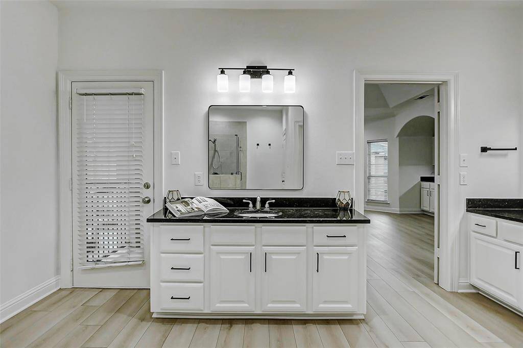 Whether you're getting ready for the day or winding down at night, this bathroom is built for both function and flow.