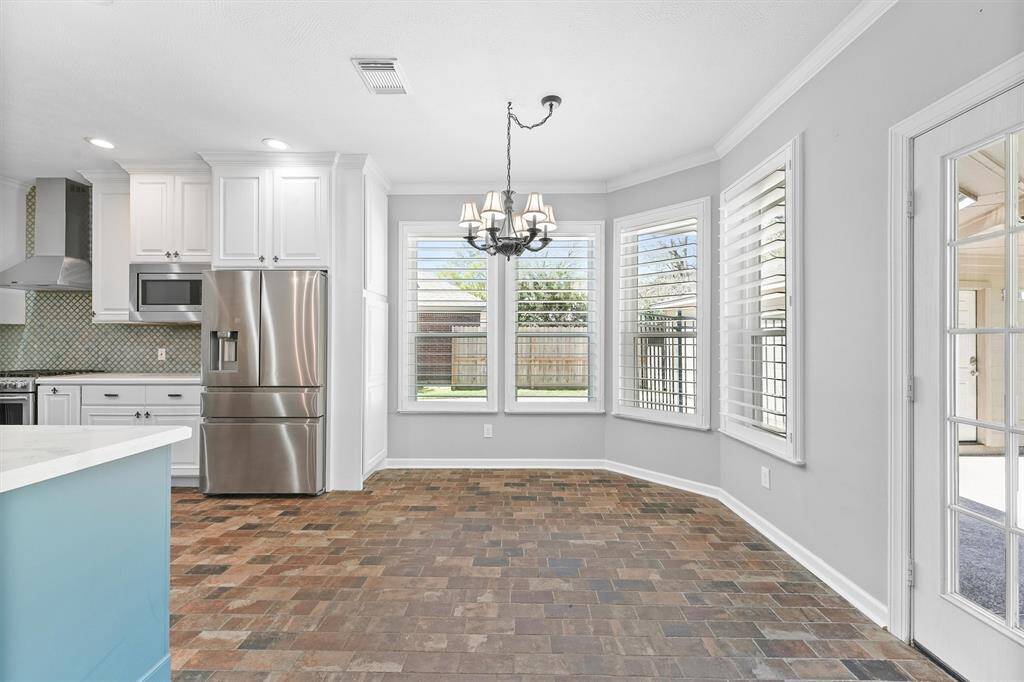 Kitchen eating with lots of natural lighting.