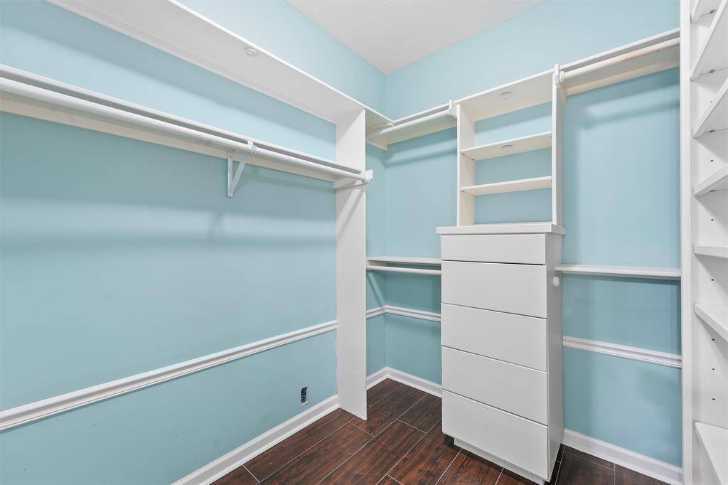 One of the primary closets with built-in drawers.