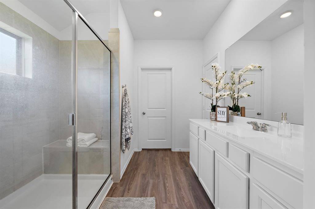 The primary bathroom offers a large, oversized shower!