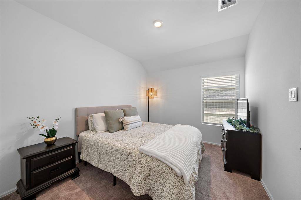 This secondary bedroom has a walk-in closet.