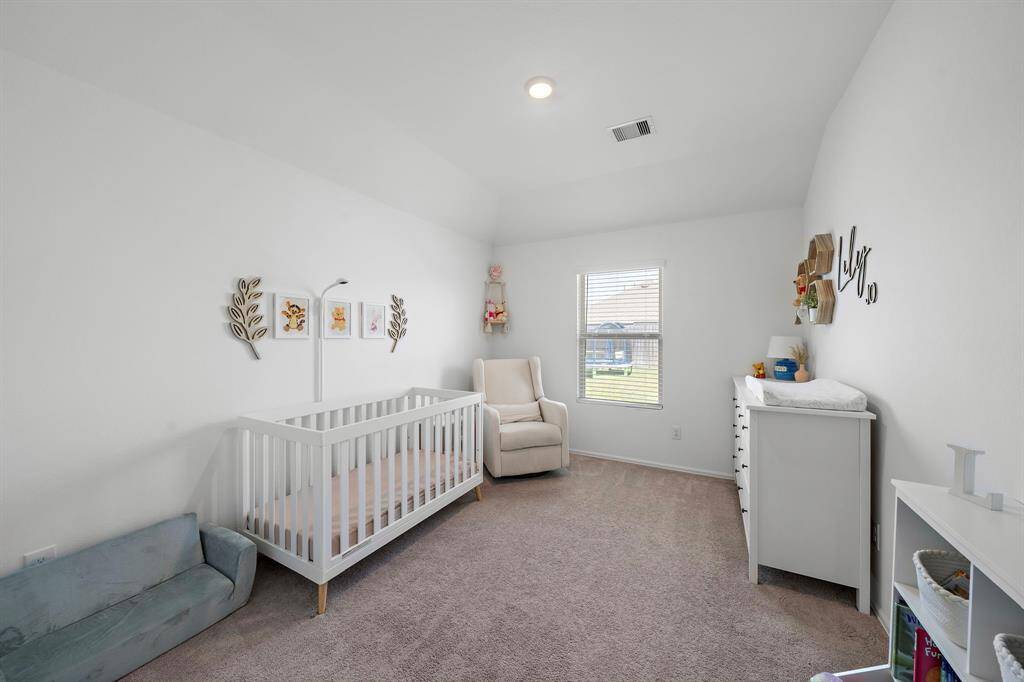 One of two secondary bedrooms. This is a spacious room with excellent natural light.