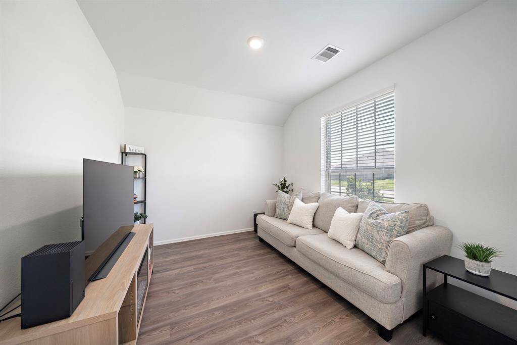 Another view of the den, which is spacious and offers ample natural light.