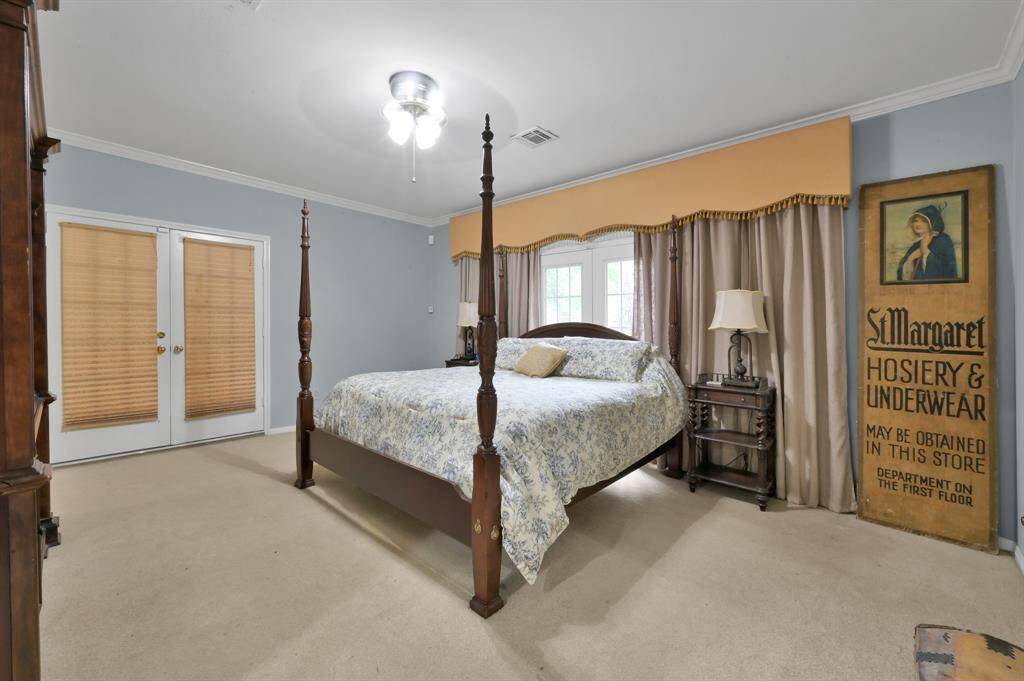 The primary bedroom is generously sized and has double doors into the loggia and another set for private access to the backyard and pool.