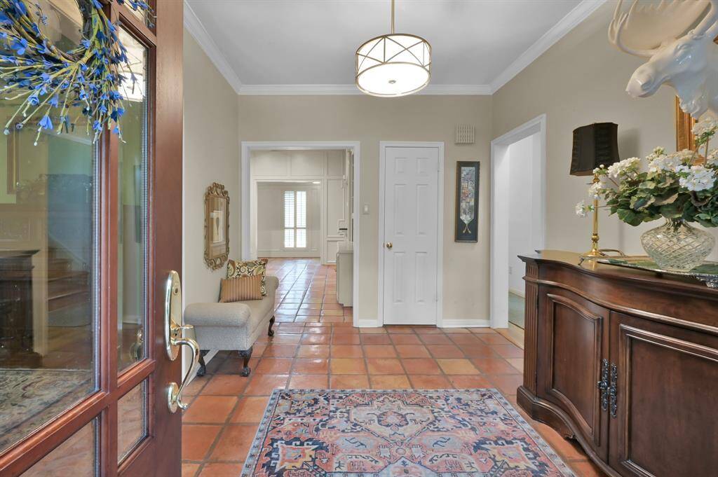 Welcome in! The entry is large and sets the tone for gracious living in this classic home.