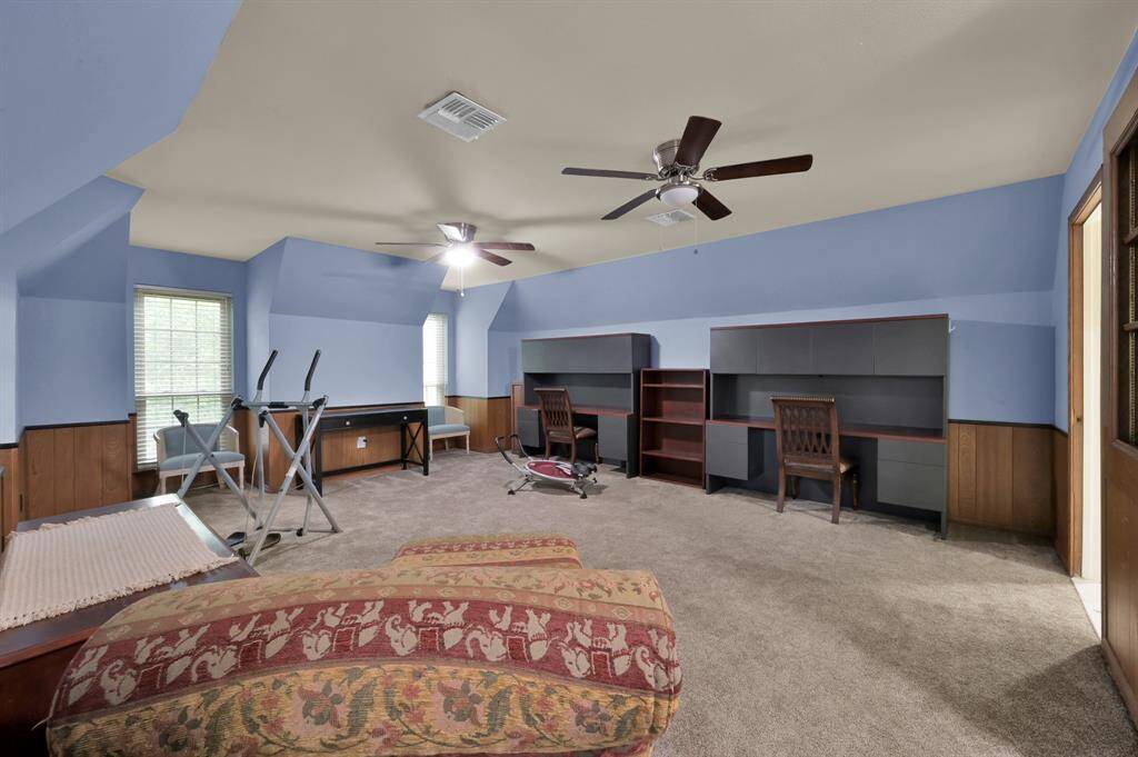 Bedroom 4 is HUGE!  Currently used as a TV/exercise/craft space, it would be perfect for several kids to share.