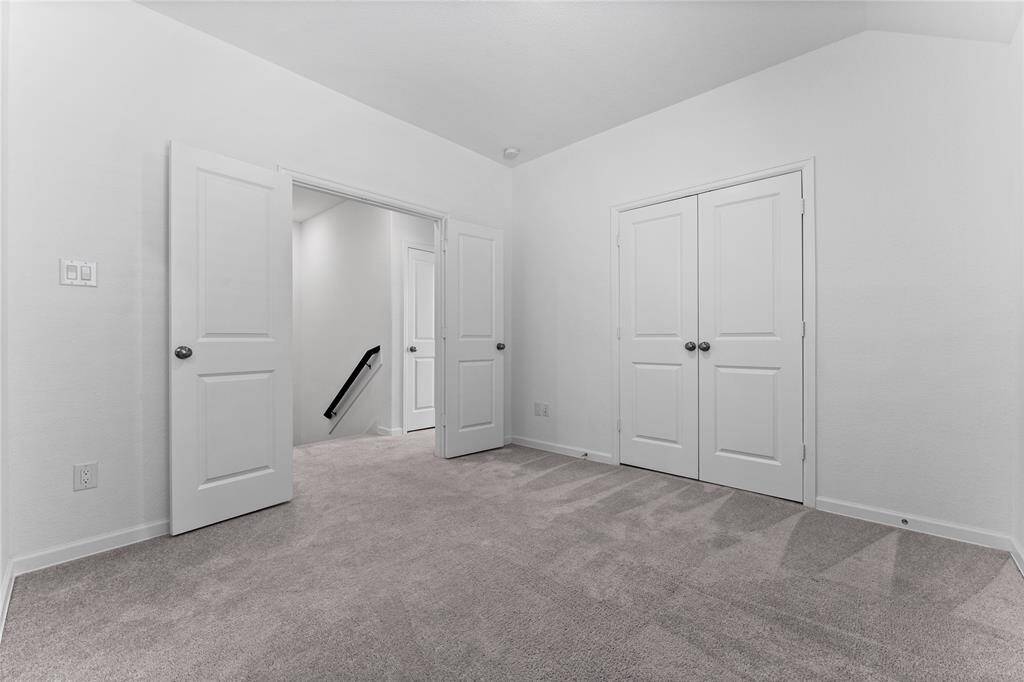 Another view of this secondary bedroom with double door entry.