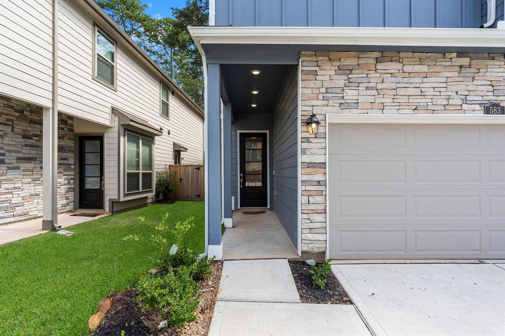 This home's striking beauty is evident the moment you arrive. Beautiful stone detailing, lush landscaping, inviting front porch, patina coach lamps, and a welcoming wood and glass door add a lot of charm to this wonderful home!
