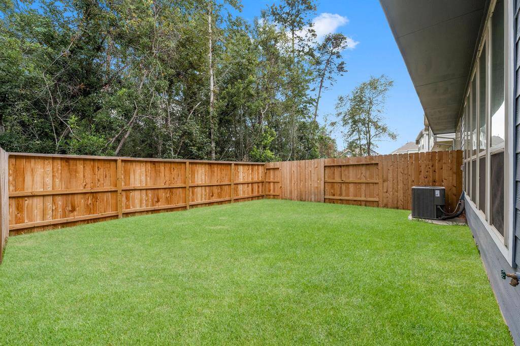 Imagine retreating here after long, hard day of work! Unwind in your private fenced back yard listening to nature in the treesl!