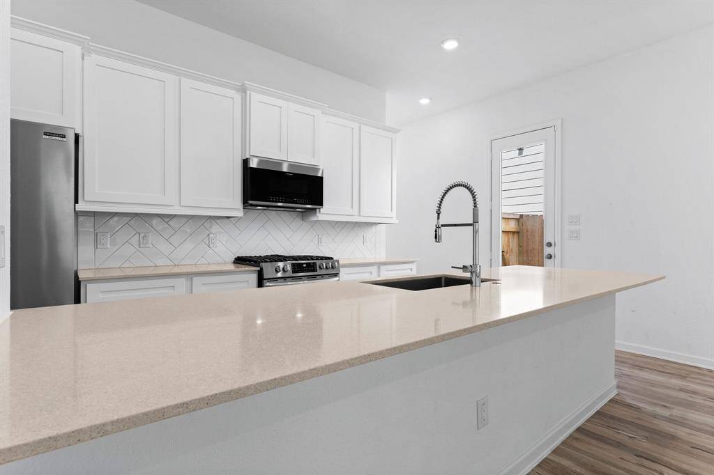 The breakfast bar is expansive and can easily seat six.