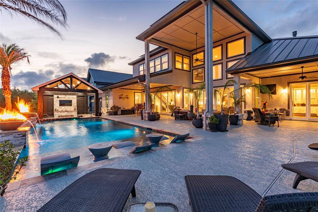 Step into resort-style luxury with a 40’ x 16’ custom designer pool by McKinney Custom Pools, engineered with 15 steel-reinforced bell bottom piers for lasting stability. This premium oasis features a Paramount ozone/UV chlorination system and top-tier Hayward equipment—delivering crystal-clear water and low-maintenance elegance.