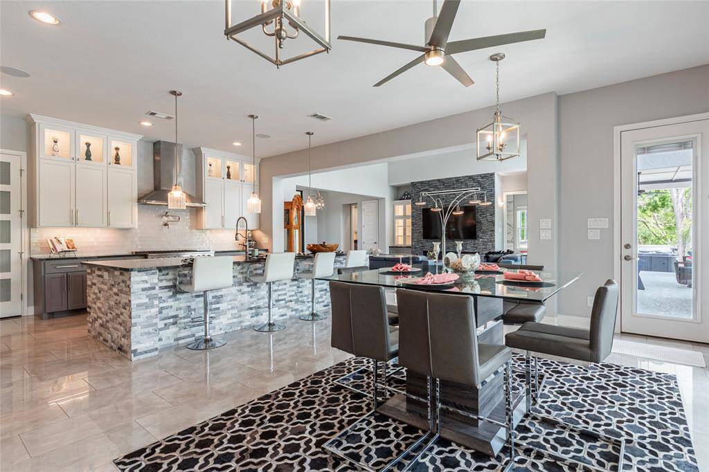 Another view highlights the luxurious open-concept layout that effortlessly blends indoor and outdoor living, creating an ideal setting for year-round entertaining and relaxation.