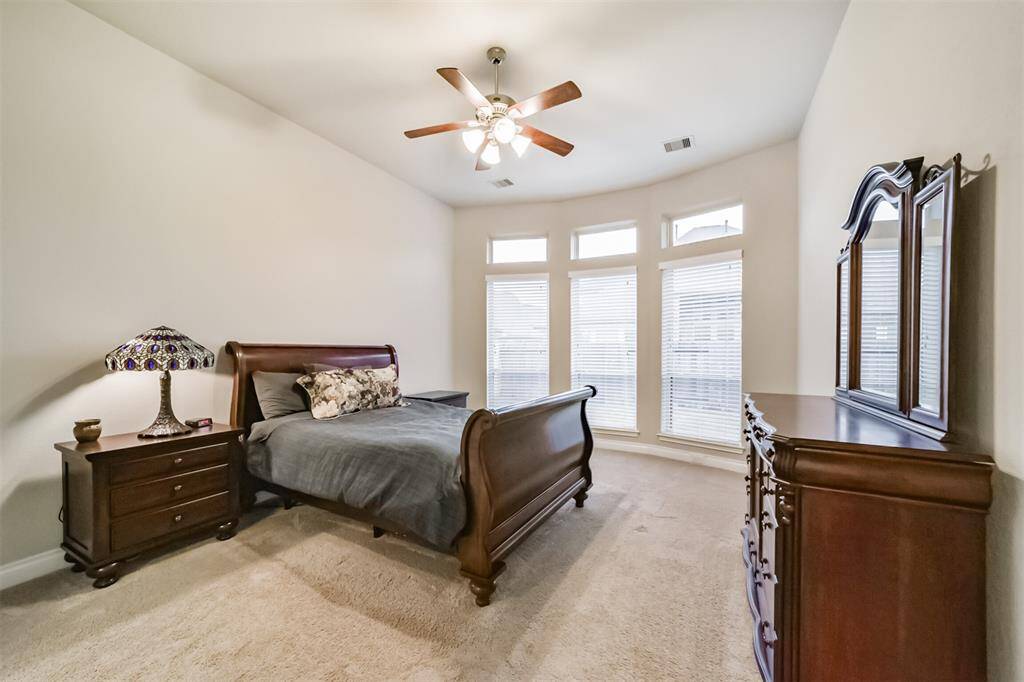 Oversized owner's retreat. Featuring large windows that offer a nice view to the backyard, bring the beauty of the outdoors in. The accent windows above offer a nice touch, allowing natural light in when the shades are closed.