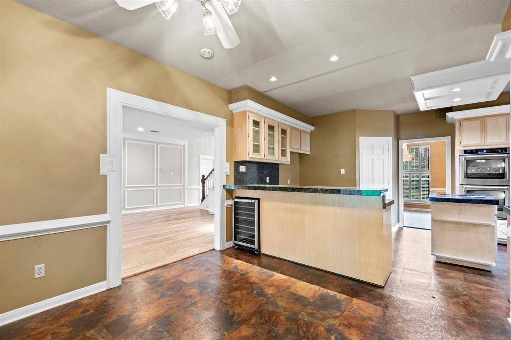 I spy a wine fridge! View from the breakfast room. You will love these high quality vinyl floors- they can withstand the largest dropped dish!