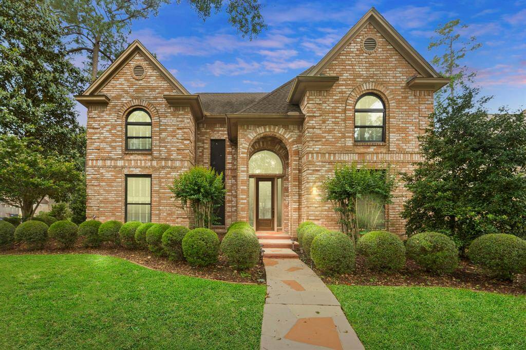 Beautiful lush landscaping welcomes you in to the grand two story entry!