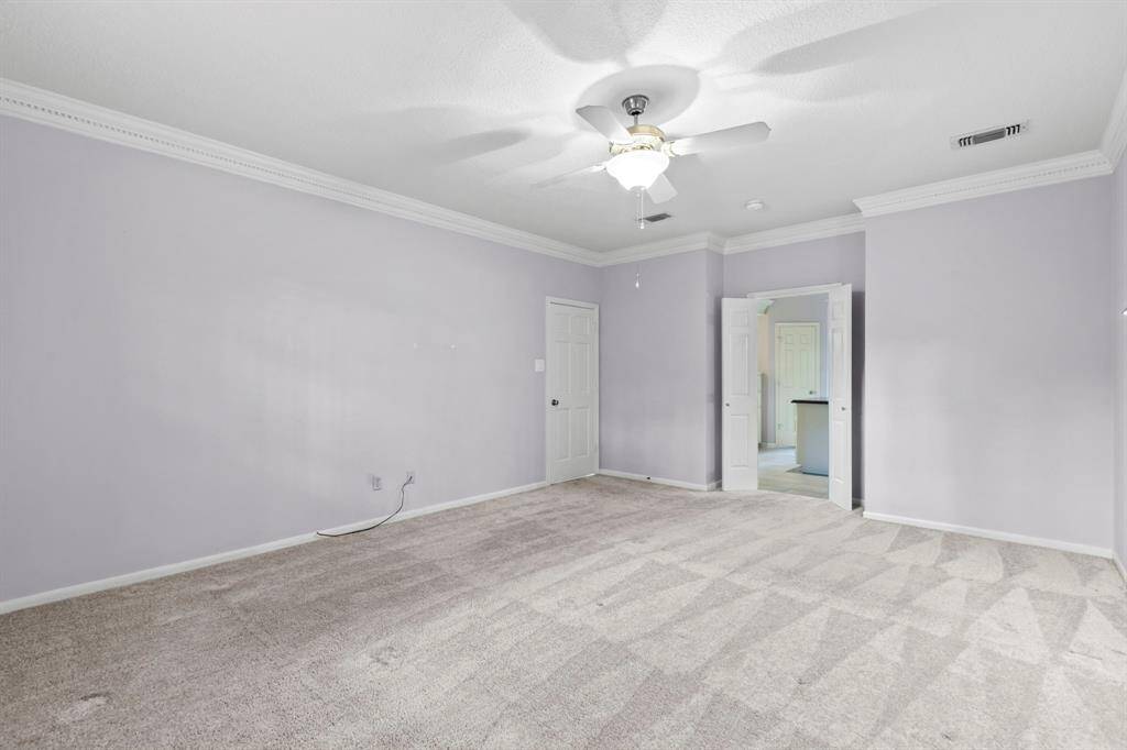 Neutral paint, white trim and crown molding, ceiling fan and ensuite bath!