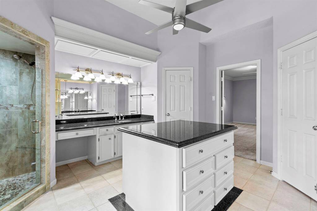 Granite counter tops and updated lighting, fixtures and hardware. Updated stand alone shower.