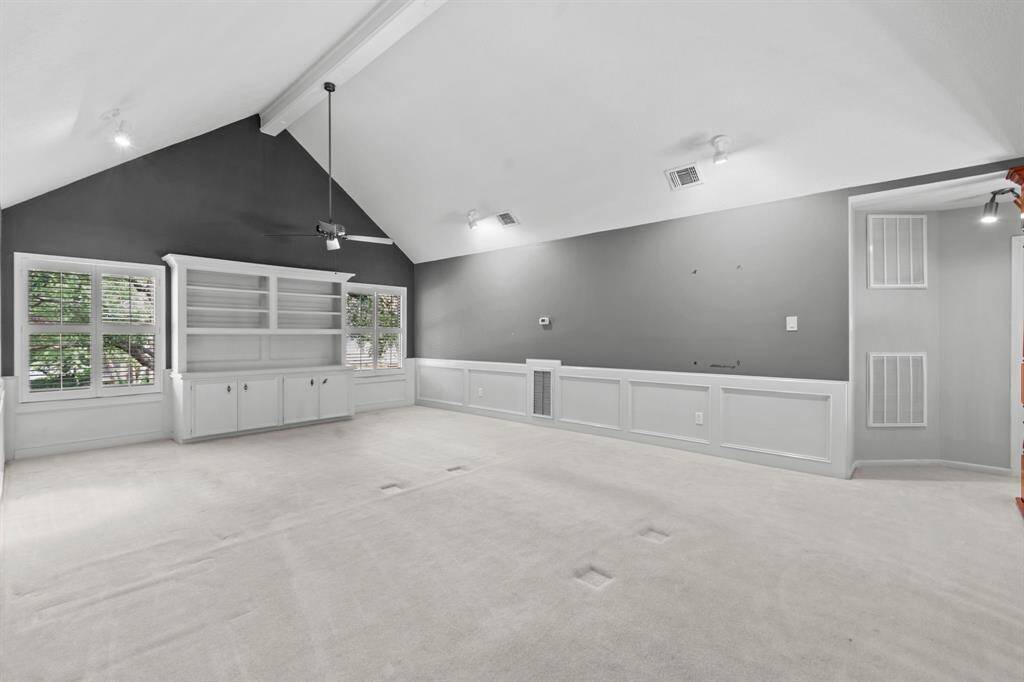 Check out this upstairs game room! Custom white built ins! Gorgeous windows! Neutral paint! So much room to make your own!