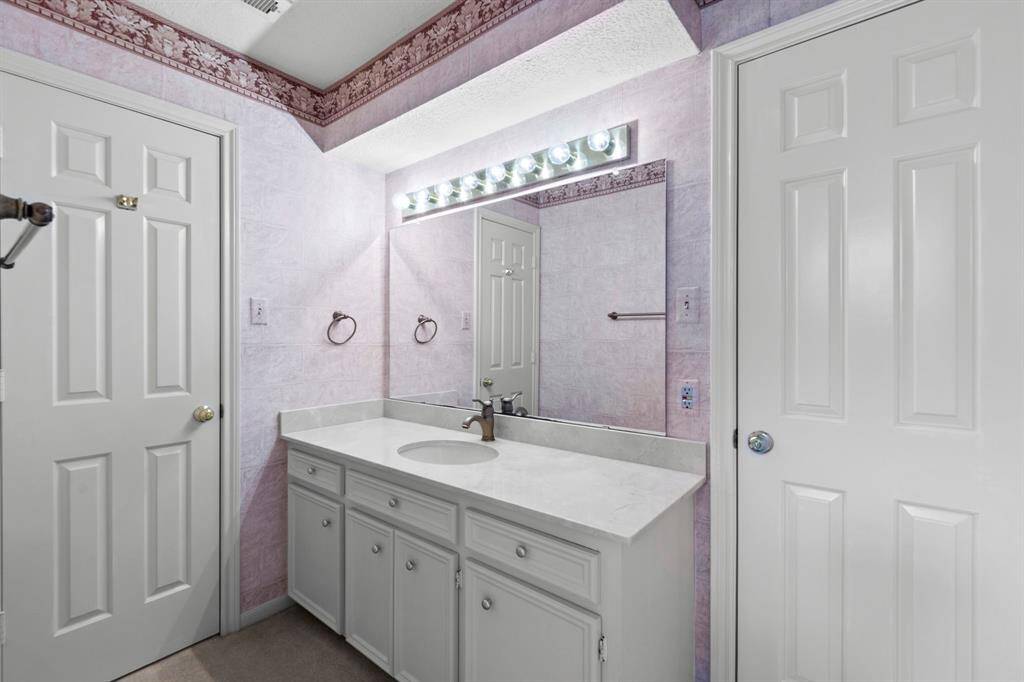 This full bath is attached to the third secondary bedroom upstairs and has a door to access it from the game room as well.