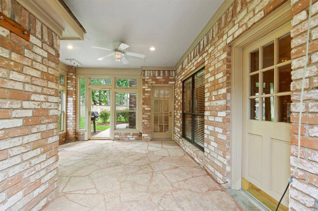 Ahhhhh! The sunroom! Sit outside without the heat and without the mosquitos! Ceiling fan, great lighting, custom floor featuring the state of Texas!
