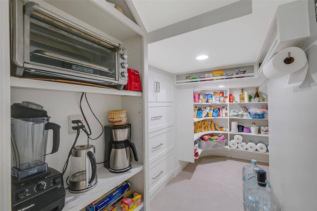 Even the utility spaces reflect luxury, with built-in cabinetry, stone countertops, and designer finishes that blend style with practicality.