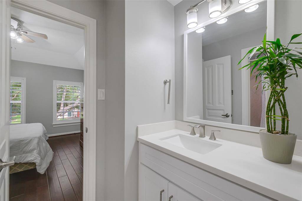 This generously sized secondary bedroom offers a serene retreat, with soft natural light streaming through large windows and high ceilings that enhance the sense of space. Perfect for family, guests, or a home office, it features elegant finishes and ample closet space, ensuring both comfort and versatility.