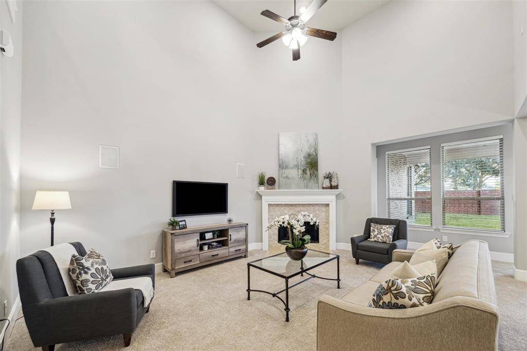 Experience the grandeur of expansive ceilings in the living room.