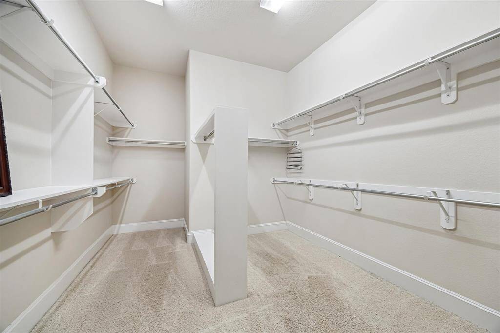 Expansive walk-in closet in the primary bath.